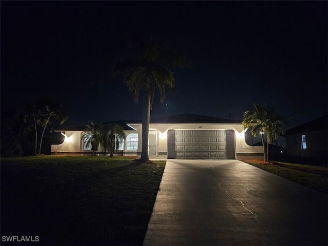 417 NW 18th Pl, Cape Coral, FL 33993 - ranch-style home with driveway and a garage