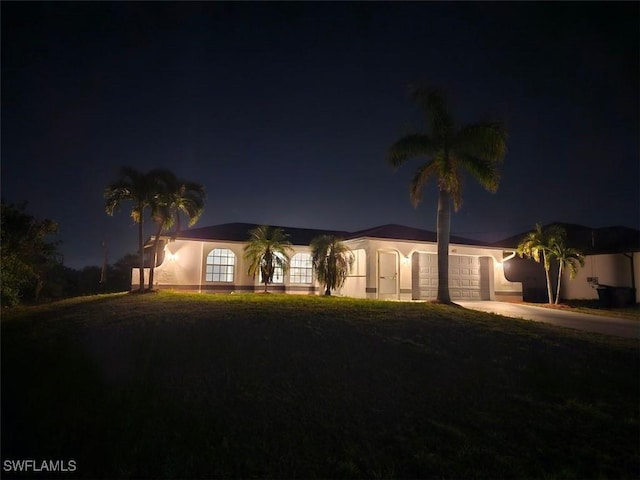 417 NW 18th Pl, Cape Coral, FL 33993 - ranch-style house featuring driveway and an attached garage
