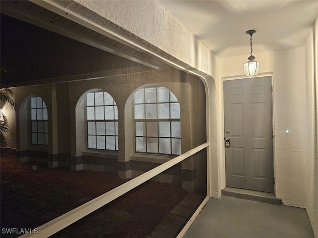 417 NW 18th Pl, Cape Coral, FL 33993 - entryway with finished concrete floors and a textured wall