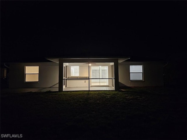 417 NW 18th Pl, Cape Coral, FL 33993 - property exterior at night featuring a patio and ceiling fan