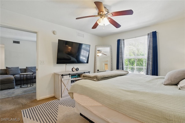 4109 Residence Dr Unit 515, Fort Myers, FL 33901 - bedroom with light carpet and ceiling fan