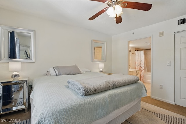 4109 Residence Dr Unit 515, Fort Myers, FL 33901 - bedroom with carpet, ensuite bathroom, ceiling fan, and baseboards