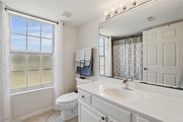4109 Residence Dr Unit 515, Fort Myers, FL 33901 - full bath featuring toilet, vanity, tile patterned flooring, curtained shower, and baseboards