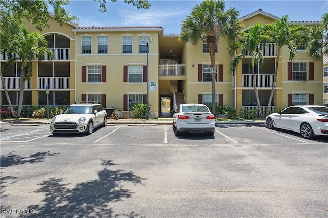 4109 Residence Dr Unit 515, Fort Myers, FL 33901 - view of apartment building / complex with uncovered parking