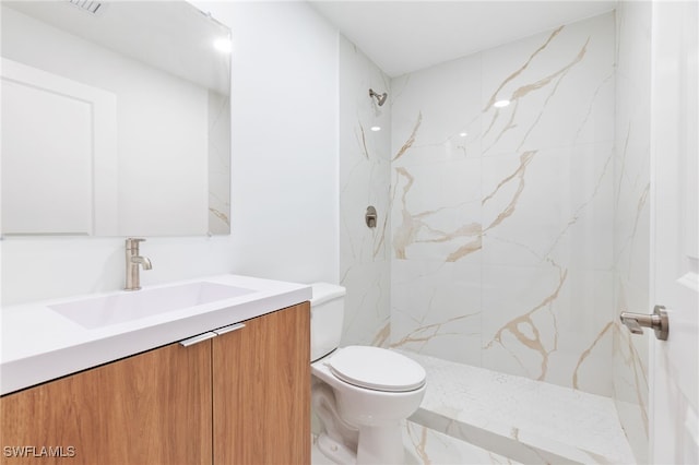 713 Wells Ave, Lehigh Acres, FL 33972 - bathroom featuring vanity, toilet, and a marble finish shower