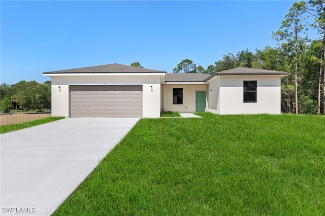713 Wells Ave, Lehigh Acres, FL 33972 - view of front of home with concrete driveway, a front yard, stucco siding, and a garage