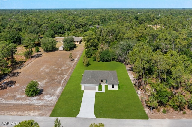 713 Wells Ave, Lehigh Acres, FL 33972 - aerial view featuring a view of trees