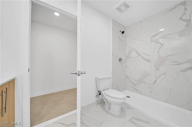 full bathroom featuring toilet, a marble finish shower, vanity, marble look tile flooring, and baseboards