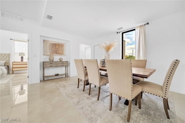 dining room with light tile patterned floors