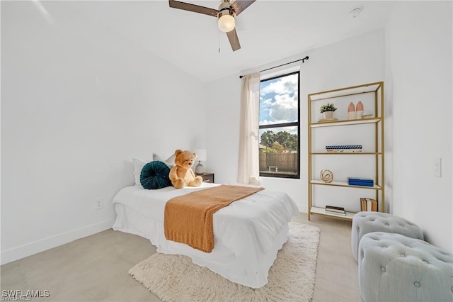 bedroom featuring ceiling fan and baseboards