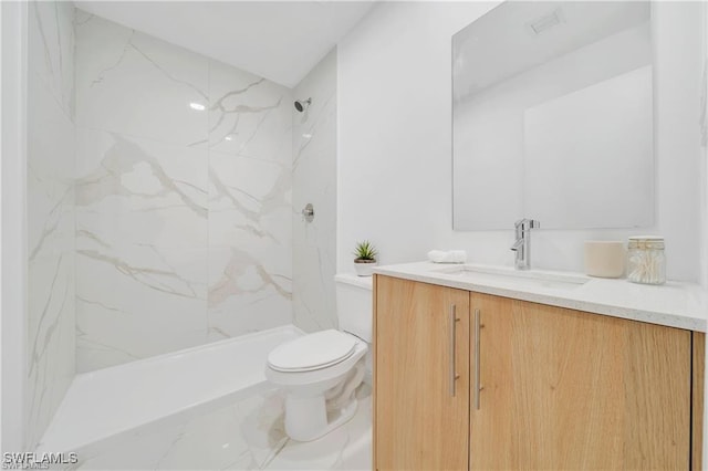 bathroom featuring vanity, toilet, and a marble finish shower