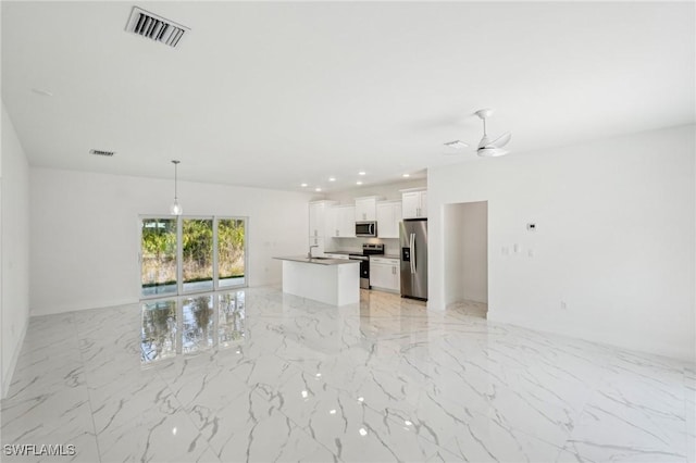 unfurnished living room with light marble finish floors, ceiling fan, and a sink