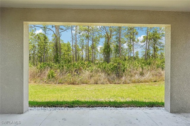 view of grassy yard with a patio