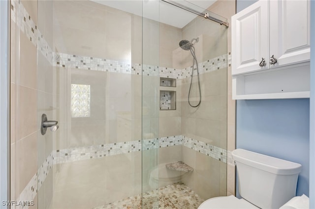 full bath with toilet and a shower stall