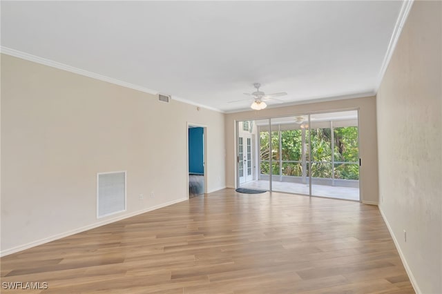 unfurnished room featuring ornamental molding, ceiling fan, baseboards, and light wood-type flooring