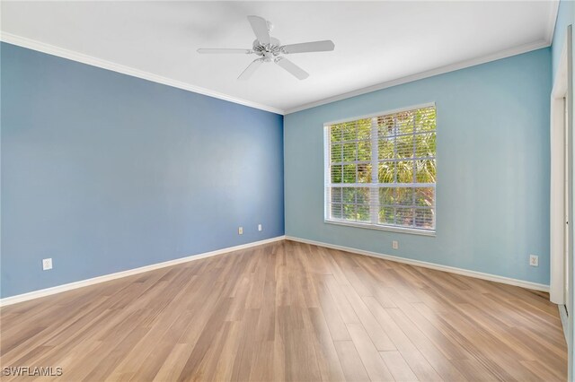 unfurnished room with wood finished floors, baseboards, ornamental molding, and ceiling fan