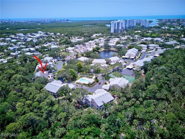 view of property location featuring a large body of water and nearby urban area