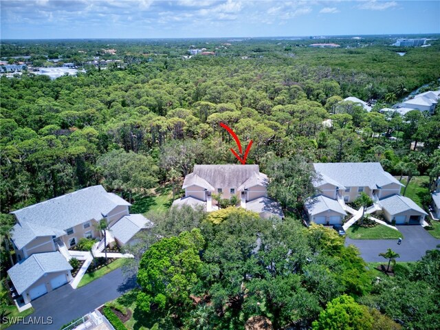 aerial perspective of suburban area with a heavily wooded area