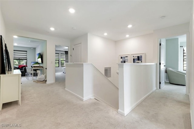10427 Ventana Ln, Naples, FL 34120 - corridor featuring light carpet, an upstairs landing, recessed lighting, and baseboards