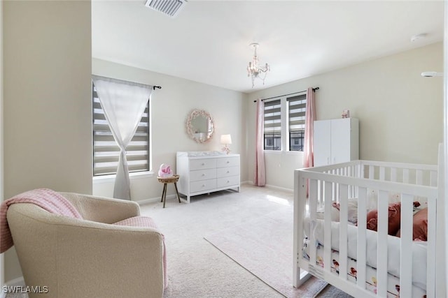 10427 Ventana Ln, Naples, FL 34120 - carpeted bedroom featuring a chandelier and baseboards