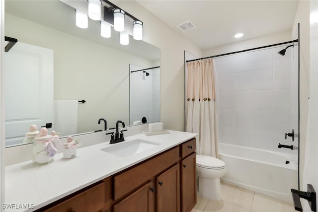 10427 Ventana Ln, Naples, FL 34120 - bathroom featuring tile patterned floors, shower / bath combo, toilet, and vanity