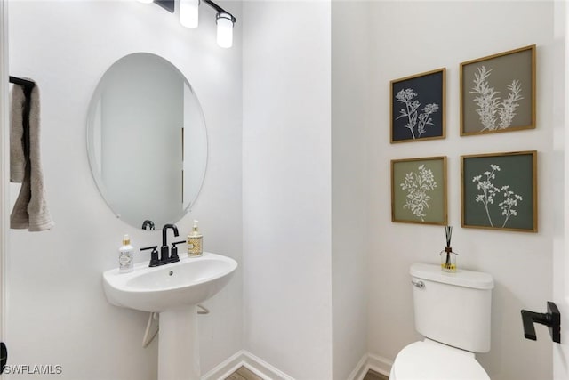 10427 Ventana Ln, Naples, FL 34120 - half bathroom with toilet and baseboards