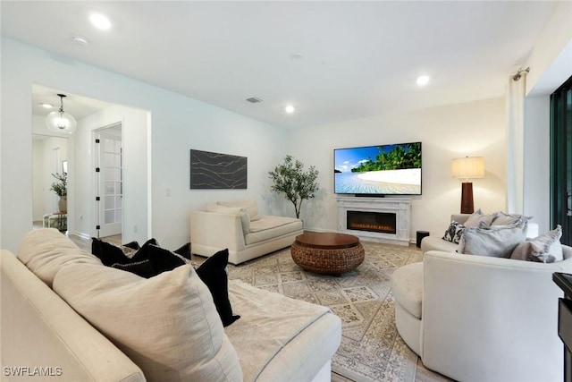 10427 Ventana Ln, Naples, FL 34120 - living area with a premium fireplace and recessed lighting
