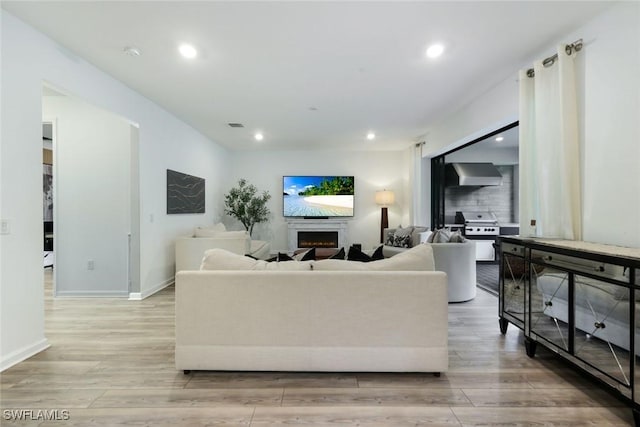 10427 Ventana Ln, Naples, FL 34120 - living room featuring light wood-type flooring, recessed lighting, and baseboards