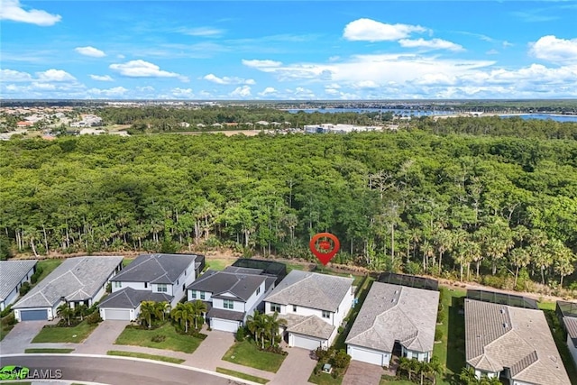 10427 Ventana Ln, Naples, FL 34120 - aerial perspective of suburban area featuring a large body of water and a heavily wooded area