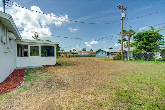 view of yard with a sunroom