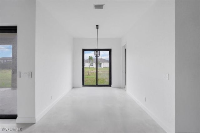 305 Diplomat Pkwy E, Cape Coral, FL 33909 - spare room with finished concrete flooring and baseboards