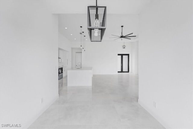 305 Diplomat Pkwy E, Cape Coral, FL 33909 - hall with a high ceiling, a sink, concrete floors, and recessed lighting