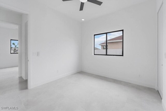 305 Diplomat Pkwy E, Cape Coral, FL 33909 - unfurnished room with a ceiling fan, concrete flooring, and baseboards