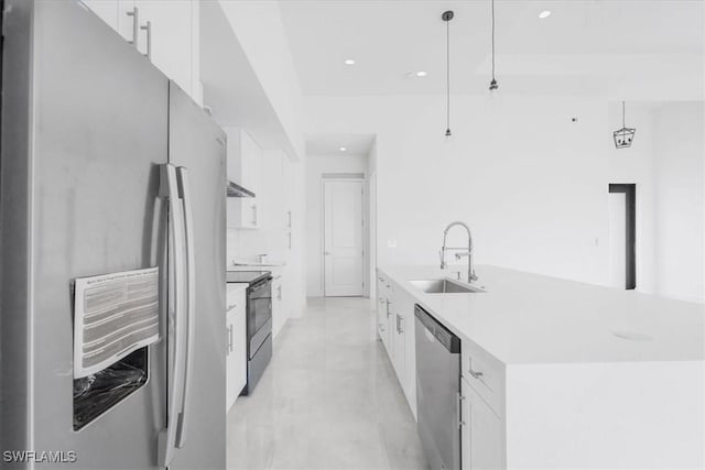 305 Diplomat Pkwy E, Cape Coral, FL 33909 - kitchen featuring stainless steel appliances, a sink, white cabinets, recessed lighting, and light countertops