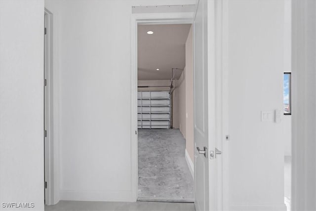 305 Diplomat Pkwy E, Cape Coral, FL 33909 - hallway featuring concrete floors and baseboards