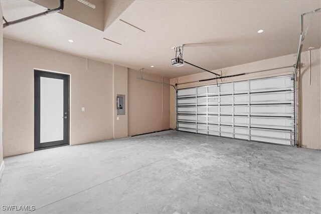 305 Diplomat Pkwy E, Cape Coral, FL 33909 - garage featuring electric panel, recessed lighting, and a garage door opener
