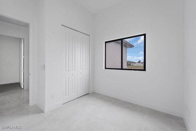 305 Diplomat Pkwy E, Cape Coral, FL 33909 - unfurnished bedroom with a closet and baseboards