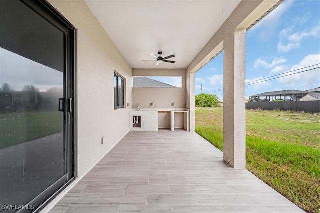 305 Diplomat Pkwy E, Cape Coral, FL 33909 - view of patio with exterior kitchen and a ceiling fan