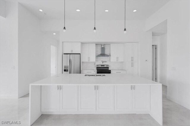 305 Diplomat Pkwy E, Cape Coral, FL 33909 - kitchen featuring appliances with stainless steel finishes, wall chimney exhaust hood, a sink, decorative backsplash, and white cabinets