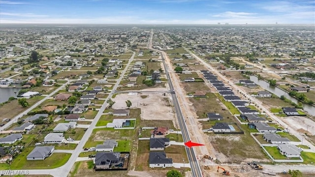 305 Diplomat Pkwy E, Cape Coral, FL 33909 - aerial overview of property's location featuring nearby suburban area and a nearby body of water