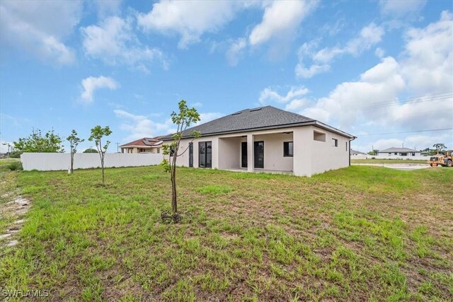 305 Diplomat Pkwy E, Cape Coral, FL 33909 - back of property featuring stucco siding