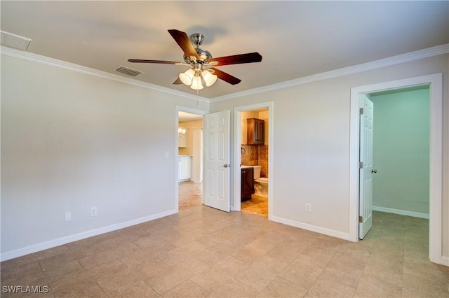 unfurnished bedroom featuring crown molding, a spacious closet, baseboards, connected bathroom, and a ceiling fan