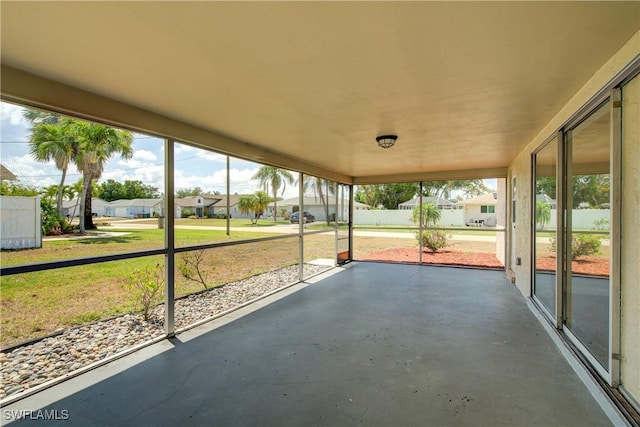 unfurnished sunroom with a residential view