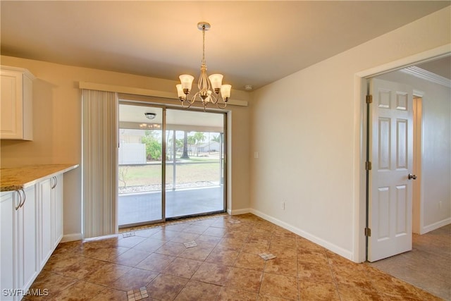 unfurnished dining area featuring a chandelier, baseboards, and light tile patterned floors
