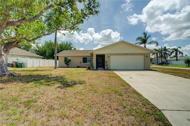 ranch-style home featuring an attached garage and concrete driveway