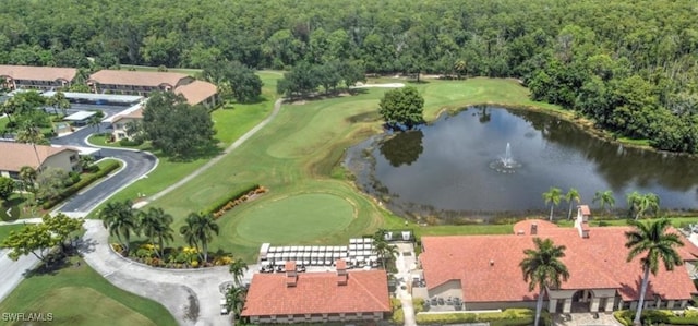 bird's eye view of a nearby body of water, a heavily wooded area, and a golf course