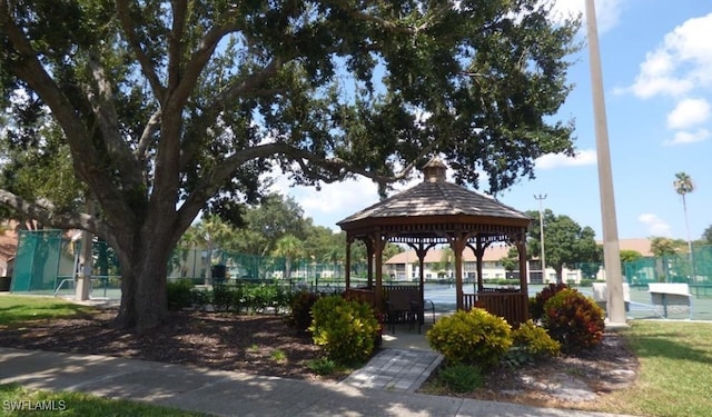view of property's community featuring a gazebo and fence