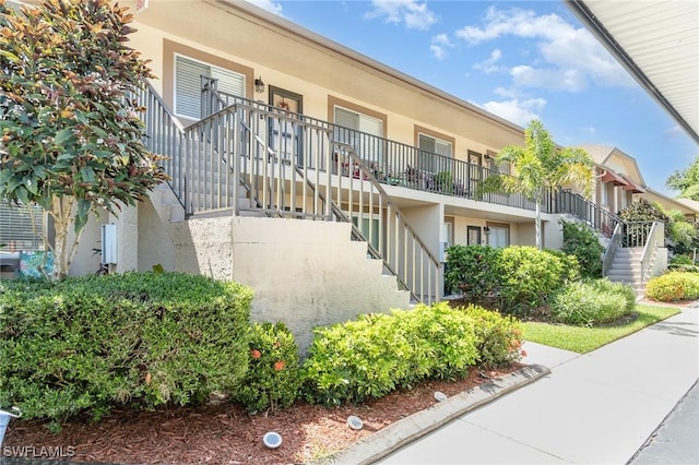 13090 Cross Creek Ct Unit 210, Fort Myers, FL 33912 - view of property featuring stairs