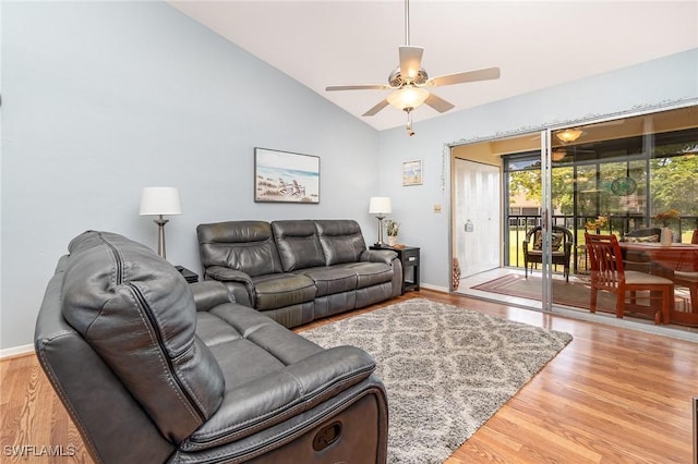 13090 Cross Creek Ct Unit 210, Fort Myers, FL 33912 - living area with vaulted ceiling, ceiling fan, and wood finished floors