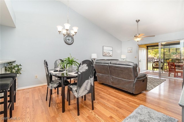 13090 Cross Creek Ct Unit 210, Fort Myers, FL 33912 - dining room featuring ceiling fan, a chandelier, light wood-style flooring, and high vaulted ceiling